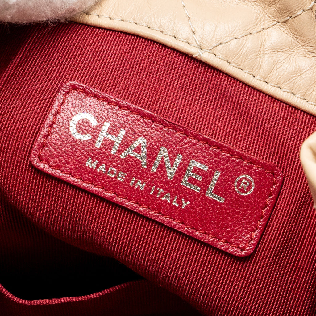CHANEL MEDIUM GABRIELLE BACKPACK AGED CALFSKIN BEIGE/BLACK MULTICOLOUR HARDWARE