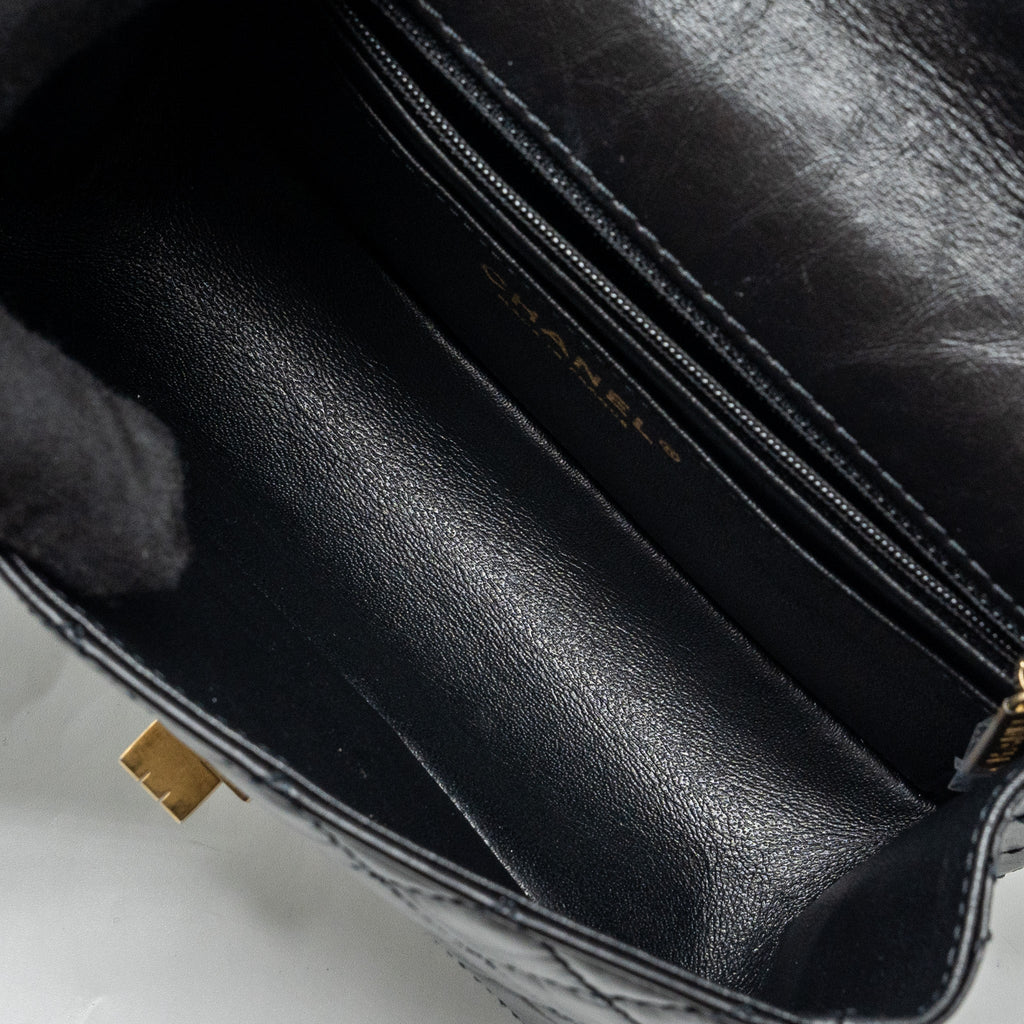 CHANEL MINI 2.55 REISSUE FLAP BAG AGED CALFSKIN BLACK GHW