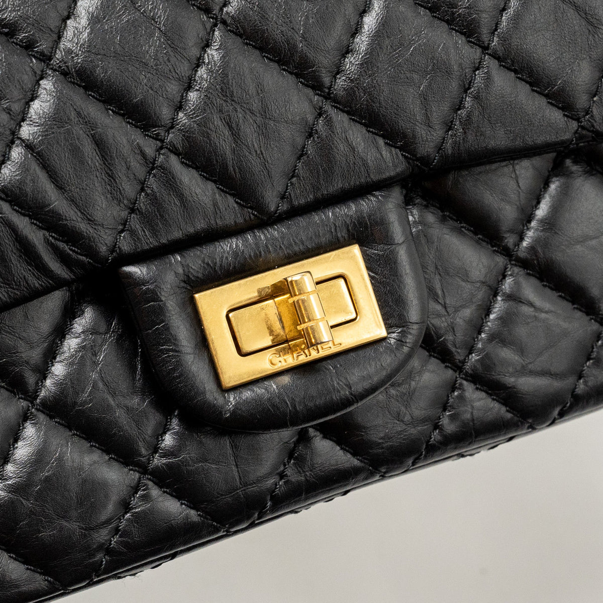 CHANEL SMALL 2.55 REISSUE DOUBLE FLAP BAG AGE CALFSKIN BLACK GHW