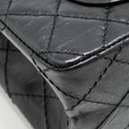CHANEL MINI 2.55 REISSUE FLAP BAG AGED CALFSKIN BLACK GHW