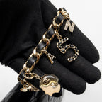 CHANEL COCO CHARMS QUILTED POUCH BAG LAMBSKIN BLACK GHW