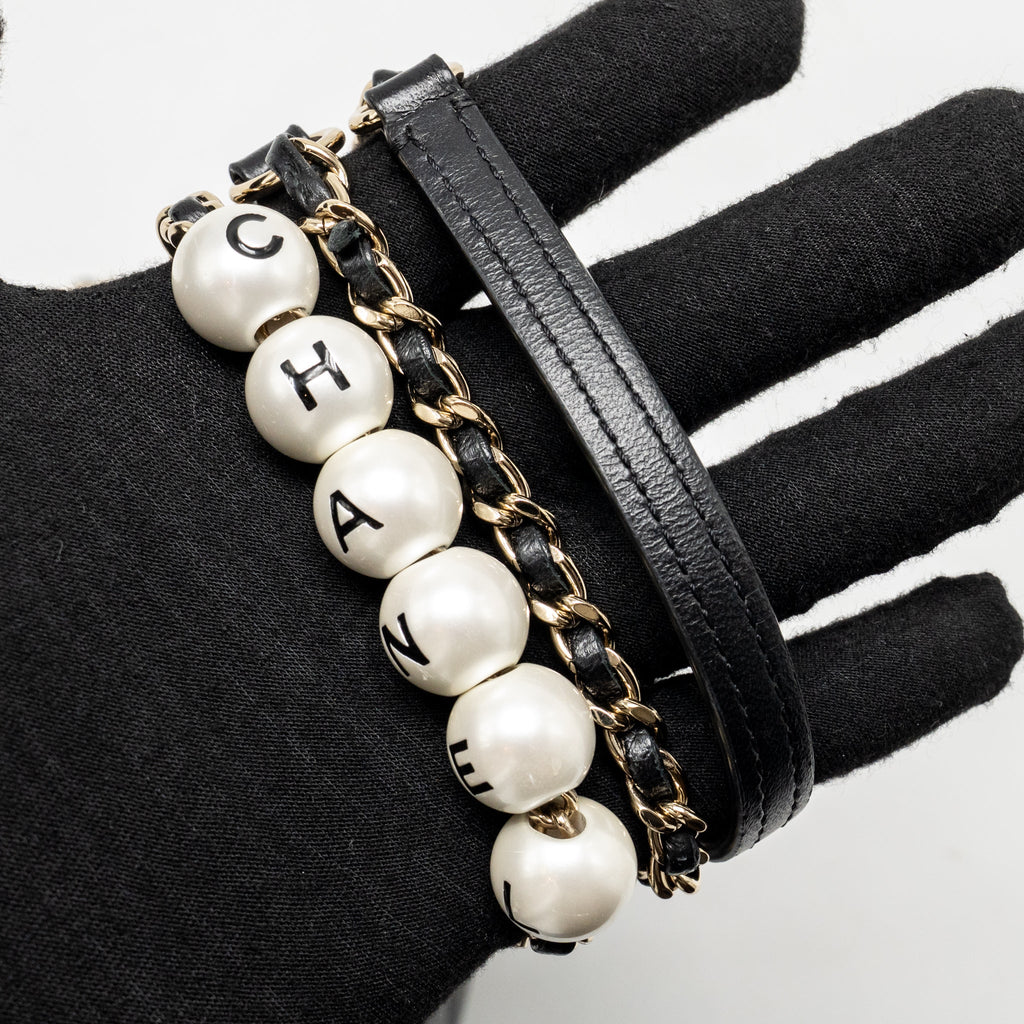 Chanel letter pearl chain mini flap clutch Lambskin black LGHW