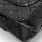 CHANEL MINI 2.55 REISSUE FLAP BAG AGED CALFSKIN BLACK BRUSHED GHW (MICROCHIP)