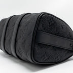 LOUIS VUITTON KEEPALL BANDOULIERE 25 MONOGRAM TAURILLON LEATHER BLACK WITH BLACK HARDWARE