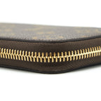 LOUIS VUITTON CLEMENCE LONG WALLET MONOGRAM CANVAS FUCHSIA