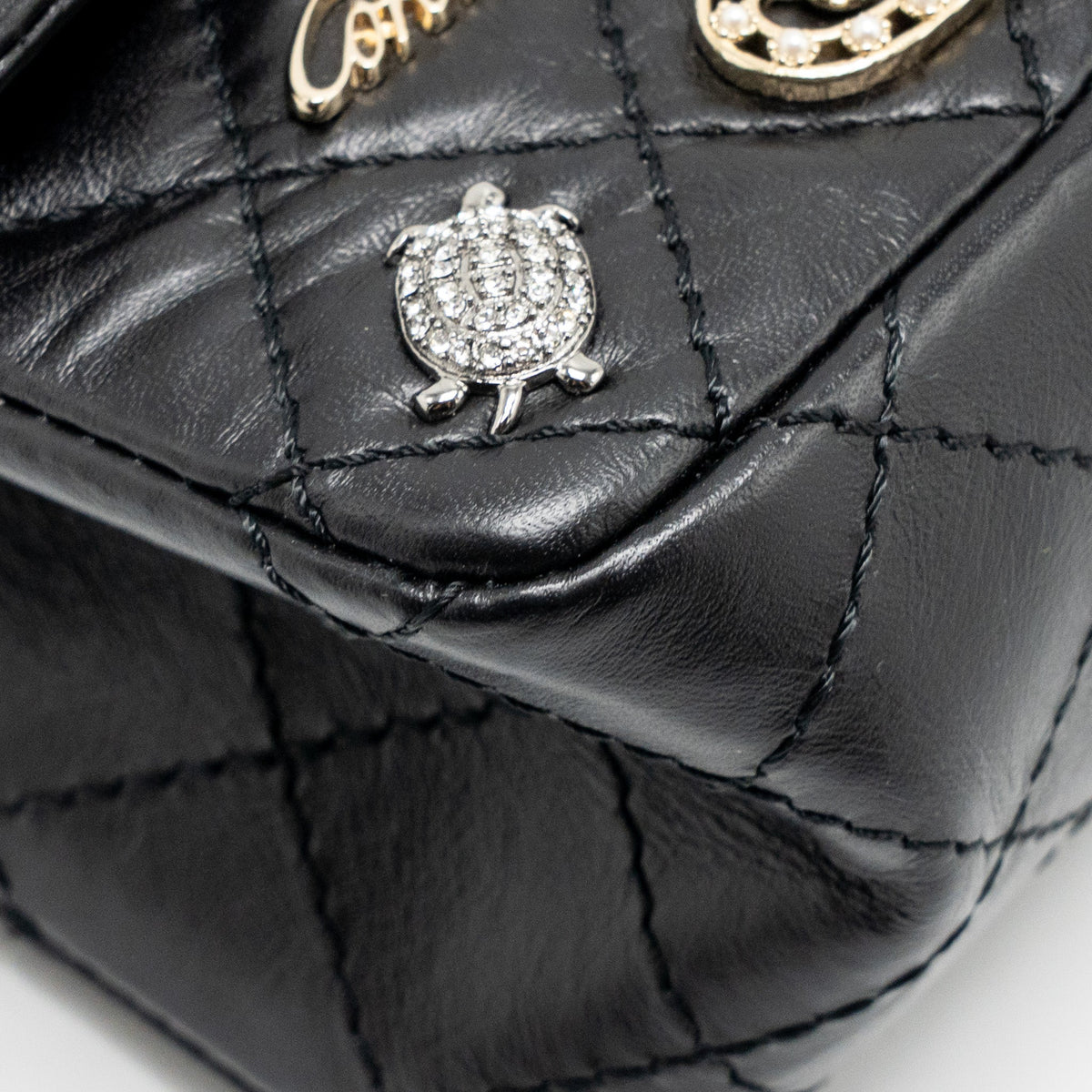 CHANEL MINI 2.55 REISSUE FLAP BAG LUCKY CHARMS AGED CALFSKIN BLACK GHW