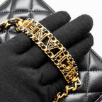 CHANEL LETTER TWIST TOP HANDLE LONG VANITY WITH CHAIN LAMBSKIN BLACK GHW (MICROCHIP)