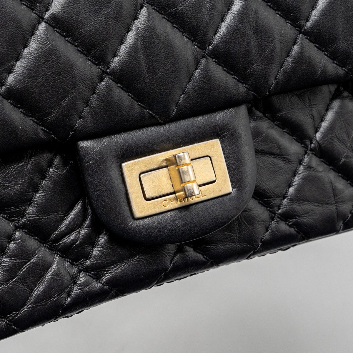 CHANEL SMALL 2.55 REISSUE DOUBLE FLAP BAG AGED CALFSKIN BLACK GHW