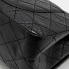CHANEL MAXI 2.55 REISSUE DOUBLE FLAP BAG AGED CALFSKIN BLACK GHW